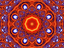 This delicate, lacy kaleidoscope, in rich blues and oranges, evokes a fiery sunset and has a moorish feel. Great subject for a jigsaw puzzle!